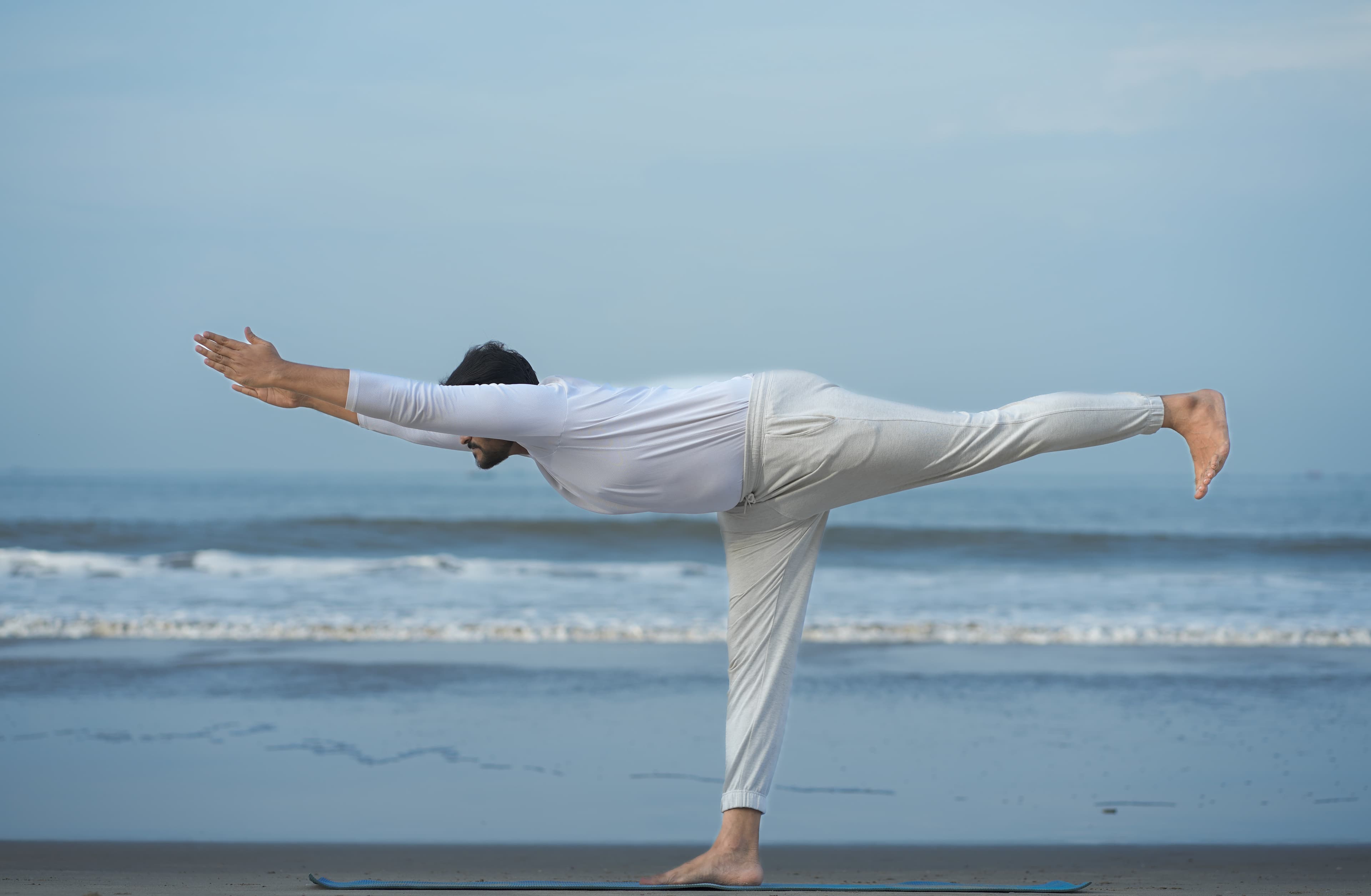 Balanced yoga practice by the sea